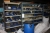 4 span steel rack containing various tools for plastic molding