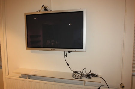 Flat screen TV, Samsung, plasma, model PPM42S3Q + shelf above radiator