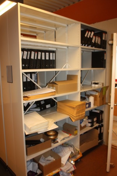 Roller Cabinet on rails, 6 sections, double sided + many empty binders + box with exhibition materials. (Filled binders and other paper must be put into container at the exit)