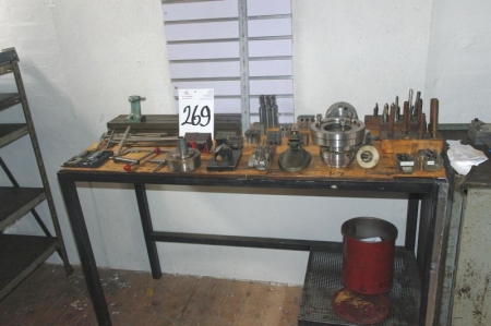 Table with various cutting tools + measuring tools, etc.