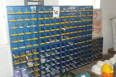Bolt racks containing various bolts and screws + fittings + nuts etc.