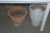 2 wooden tables containing various Clothing + jars + vases etc.