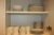 Various crockery, cutlery, etc. in kitchen cabinets and on top of kitchen cabinets