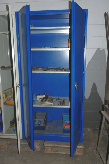 Steel cabinet containing various drills etc.
