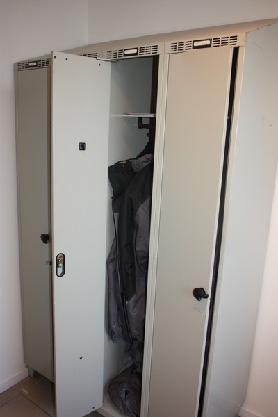 4 span lockers + 4 folding chairs, wood + clothing in closets (cleaning cart not included)