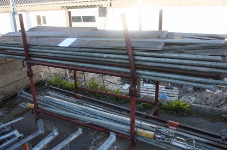 2 racks with scaffolding + pallet with lintels, etc.