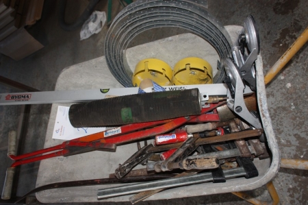 Wheelbarrow with ground drill, hole saw, hand tools, etc.