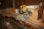 Power: telescopic crosscut saw, DeWalt, mounted on carpenter workbench