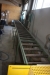 Crosscut system with roller conveyor inlet and outlet