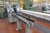Div Muller Martini saddle stitcher type: Tempo, year: 2000, consisting of 7 feeders + 1 pre stitcher + 1 adhesive unit + 1 empty space + 1 stapler + one 3-cutter + 1 stacker + 1 ionization device + 1 strapping machine