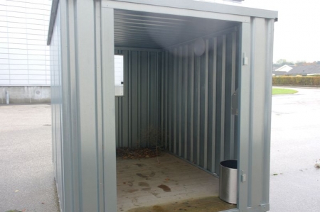 Container arranged as smoking shed. H: 2.13m W: 2.13m L: 3 m