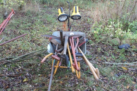 Wheelbarrow with tools and lamp