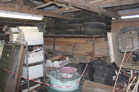 Rack with various wood + tire + styrofoam boxes + pots + various iron, etc.