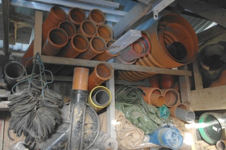 Content on shelves and below the ceiling: various sewer parts + auger + screws, etc.