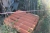 Miscellaneous wood + pallet cages + pallet of roofing sheets