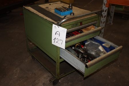Tool cabinet with various drills, rivets etc.