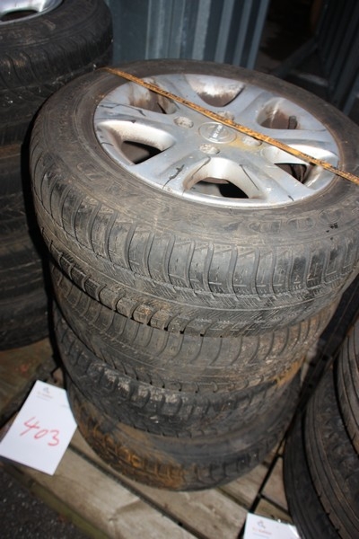 4 winter tires on alloy wheels, Nissan, 4-hole. Tires: 185/65 R14