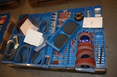 Pallet with assorted sanding belts, grinding rings, grinding points, emery cloth, abrasive discs, etc. Pallet not included