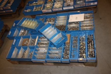 Pallet with assorted nuts and bolts, lock nuts, lock washers, lock washers, etc. Pallet not included