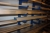 Pallet Racking, one-sided, length approx. 6 meter, 10 shelves. Content, various aluminum + pallet of goods on the floor by the rack, aluminum