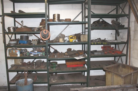 3 span steel rack containing various flanges, etc.