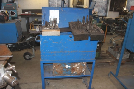 Tool box on wheels containing various threading tools