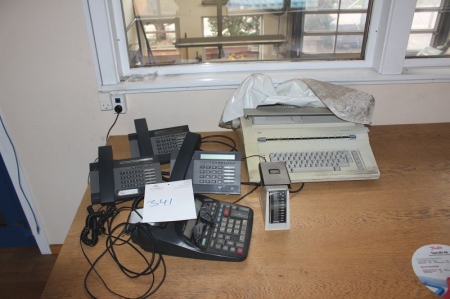 All on table, including phones + calculator + typewriter