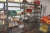 3 span steel rack containing various rods + consumables + nail + screws + tools, etc.