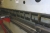 Press brake, Baykal, model 10/2006, type Aph 3110x200mm, max 3100 mm, with PRG 920 control. Capacity 200 T, Serial No. 10852. System pressure 265 bar, weight 10500 kg. L: 3500 mm W 1900 mm H: 2550 mm. Rack with a lot of press tools included.