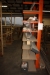 Content on one side of cantilever racking, various lists + wood trestle etc.