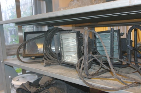 Content on the shelf of rack. Work Lamps + tighten straps + box of chisels, etc.
