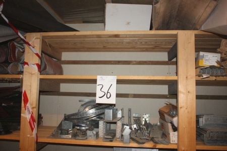 Contents of 2 shelves in wooden rack, including 5 corner protection profiles, stormbelt + various construction hardware