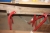 Content in 2 sections in wooden rack. including sealing tape, U-profiles (aluminum) + buckle, door handles + nail + screws + wind blocker + rubbers + old carpenter tools + hole saw + 4 trestles + package on the floor with floorboards (labeled Juncker), et