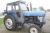 Tractor, Leyland 255 Hours: 6046. Runs OK. Missing side cover plates on motor. Tires are worn. Lights serviced.