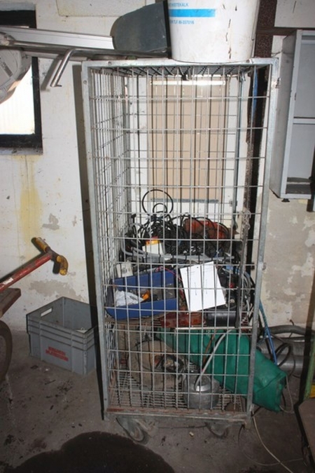 Mesh wire cage on wheels with content including Various electric parts + mailbox