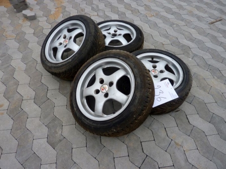 Alloy wheels with new tires, said to fit a Polo. For sale by private individual. VAT applicable on Buyers Premium only