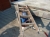 Wheelbarrow + stone cutter + cable reel + hole in one + cut-off saw + ladder, wood. For sale by private individual. VAT applicable on Buyers Premium only