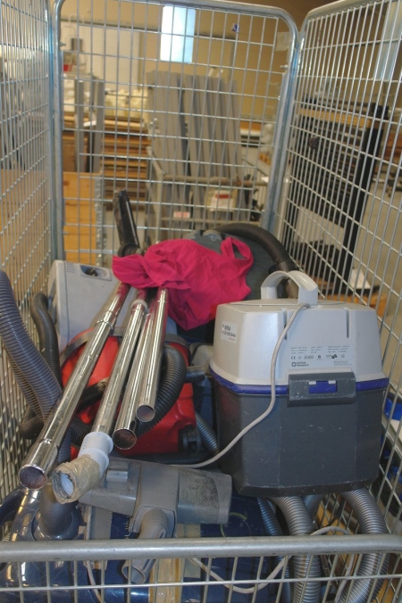 Mesh wire cage with various vacuum cleaners (condition unknown)