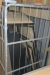Mesh wire cage with various wooden boards, etc.