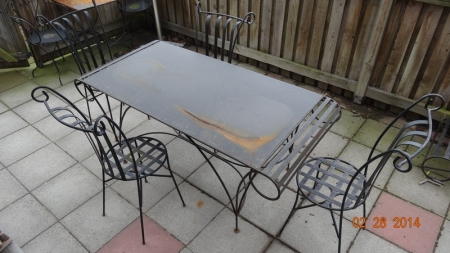 Table with 4 chairs. Wrought iron table and chairs. Retro provence style. Table approx. 168x77 cm. Height approx. 73 cm. Highly detailed and beautifully done. In need of TLC