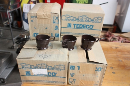 Approximately 140 plastic mug holders, TEDECO