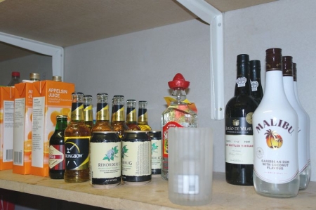 Content on the shelf: Various bottles of liquor, etc.