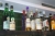 Contents of shelf: various bottles of liquor, broached