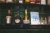 Contents of shelf: various bottles of liquor, broached