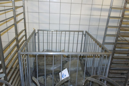 Stainless steel cage on wheels with content