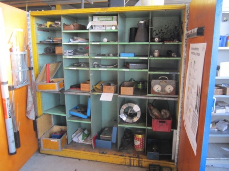 Steel cabinet with 2 doors, containing pressure gauges, tools, drills, hand tools, honing set, measuring equipment, welding wire, reamers and more