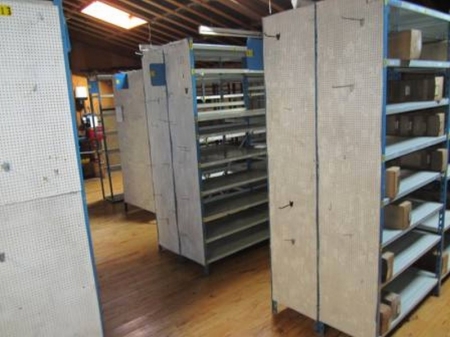 Storage racks with cardboard storage boxes, approx. 31 in total, and loose shelves, all shelves to the east except wooden office bookcase