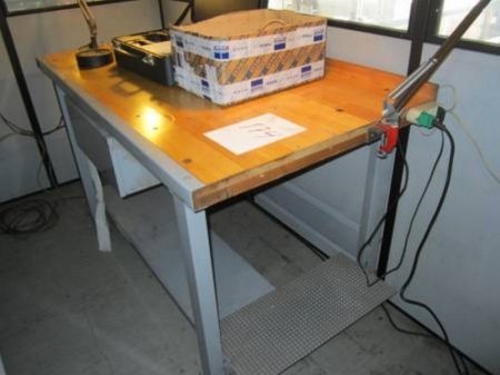 Work bench with drawer under the table and lamps