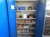 Steel cabinet with 2 doors, containing pressure gauges, hand tools, welding glass, abrasives, fittings and more