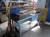 Vise bench with drawer as well as brooms and shovel, ladder, etc.